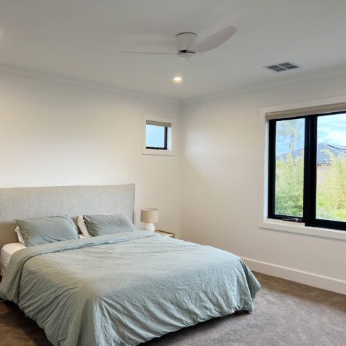 modern low profile ceiling fan in bedroom